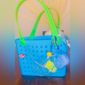 Blue Tote Bag with Green Handles and Charms and 5 hair products